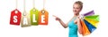 Shopping Sale. Happy woman is holding shopping bags. Royalty Free Stock Photo