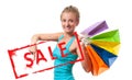 Shopping Sale. Happy woman is holding shopping bags. Royalty Free Stock Photo