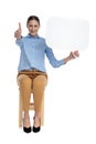 Happy woman holding speech bubble and making thumbs up sign Royalty Free Stock Photo