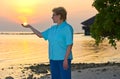 Happy woman holding sun on beach Royalty Free Stock Photo