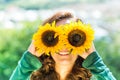 Happy woman holding sunflower glasses Royalty Free Stock Photo