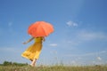 Happy woman holding umbrella and cloud sky Royalty Free Stock Photo