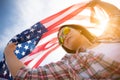 Happy woman holding United States of America flag Royalty Free Stock Photo