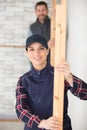 happy woman holding wooden plank