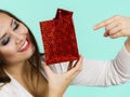 Happy woman holds red gift bag Royalty Free Stock Photo