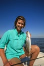 Woman Saltwater Fishing Holding a Speckled Trout in Louisiana
