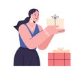 Happy woman with holiday gift box in hands. Person preparing presents and surprises for birthday. Excited female holding