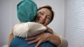 Happy woman hugging doctor, good test results, recovery and remission, gratitude