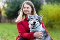 Happy woman hugging dog. pet adoption.  czechoslovak with female owner. Royalty Free Stock Photo