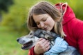 Happy woman hugging dog. pet adoption. czechoslovak with female owner.