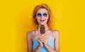 happy woman with icecream isolated on yellow. woman with icecream in studio.