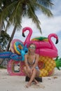 Happy woman with inflatable toys on the beach Royalty Free Stock Photo