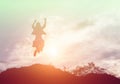 Happy woman jumping against beautiful sunset. Freedom, enjoyment concept Royalty Free Stock Photo