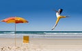 Happy woman jumping at beach Royalty Free Stock Photo