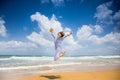 Happy woman jumping at the beach Royalty Free Stock Photo