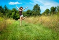 Happy woman jumping in a field