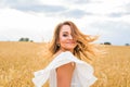 Happy woman jumping in golden wheat Royalty Free Stock Photo