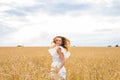 Happy woman jumping in golden wheat Royalty Free Stock Photo