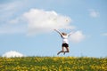 Happy woman jumping on meadow. Royalty Free Stock Photo