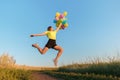 Happy woman jumping with multicolored balloons Royalty Free Stock Photo