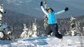 Happy woman jumping at winter mountains, active female enjoying nature, Royalty Free Stock Photo