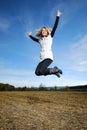 Happy woman jumps Royalty Free Stock Photo