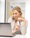 Happy woman with laptop computer and credit card Royalty Free Stock Photo