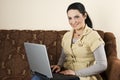 Happy woman with laptop home Royalty Free Stock Photo