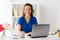 Happy woman with laptop working at home or office Royalty Free Stock Photo