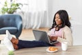 Happy woman with laptop working at home office Royalty Free Stock Photo