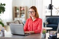 Happy woman with laptop working at home office Royalty Free Stock Photo