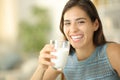 Happy woman laughing and posing holding milk glass Royalty Free Stock Photo