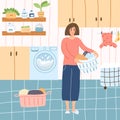 Happy woman in laundry with basket full of clothes in cartoon flat style. Vector illustration of girl in bathroom