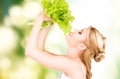 Happy woman with lettuce Royalty Free Stock Photo