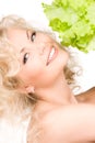 Happy woman with lettuce Royalty Free Stock Photo