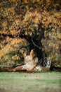 Happy Woman Life Style, beautiful asian girl on the nature picnic with fruits. Relaxing asian woman in Nature. Autumn landscape Royalty Free Stock Photo