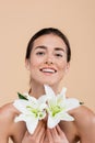 happy woman with lily flowers looking