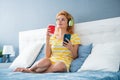 Happy woman listening to music on smartphone at home, music Royalty Free Stock Photo