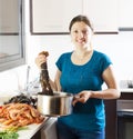 Happy woman with lobster in home Royalty Free Stock Photo