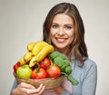 Happy woman with long hair and big toothy smile holding straw ba Royalty Free Stock Photo