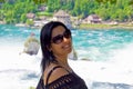 Happy woman looking at camera in rhine falls, Switzerland Royalty Free Stock Photo