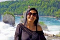 Happy woman looking at camera in rhine falls, Switzerland Royalty Free Stock Photo