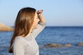 Happy woman looking forward at the horizon