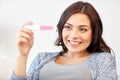 Happy woman looking at home pregnancy test Royalty Free Stock Photo