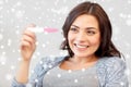 Happy woman looking at home pregnancy test Royalty Free Stock Photo