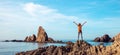 Happy woman looking at rock formation in sea- Cabo de gata Royalty Free Stock Photo