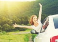 Happy woman looks out the car window on nature Royalty Free Stock Photo