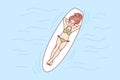 Happy woman lying on board in sea