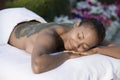 Happy Woman Lying On Massage Bed With Mud Pack Applied On Back Royalty Free Stock Photo