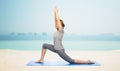 Happy woman making yoga in low lunge on mat Royalty Free Stock Photo